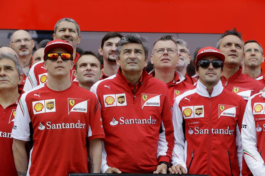 Marco Mattiacci, nuovo team principal della rossa, con Raikkonen e Alonso. Ap